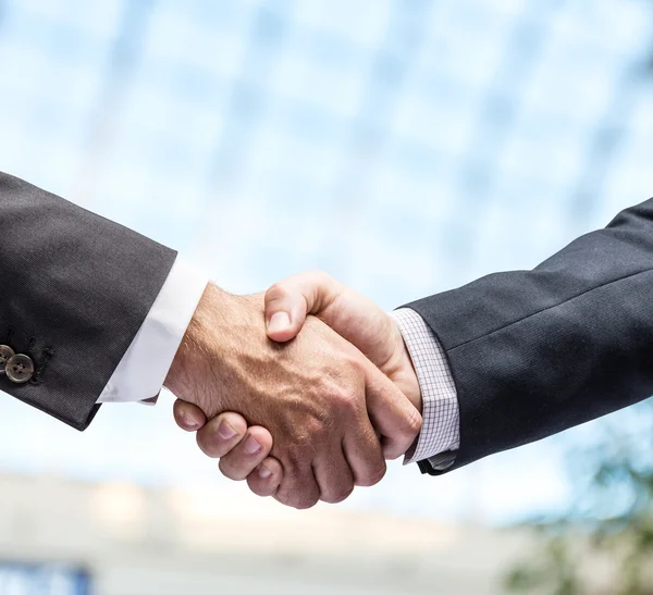 depositphotos_90868150-stock-photo-handshake-closeup-shot-of-hands
